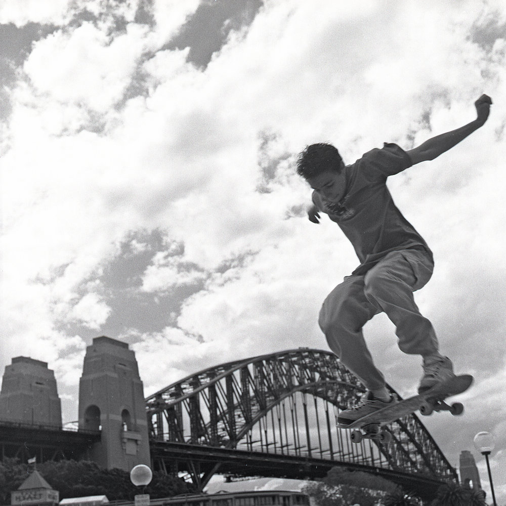 Skater against background of Harbour Bridge, Circular Quay Sydney, 2000 |  City of Sydney Archives