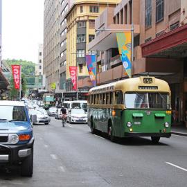 Cyclist in traffic, Market Street Sydney, 2017