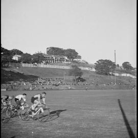 Three men cycling, Trumper Park, Glenmore Road Paddington, 1936