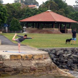 Woman practising yoga on the foreshore path at Federal Park, Glebe, 2015