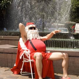 Beachy Santa reclines in front of El-Alamein Fountain, Fitzroy Gardens Kings Cross, 2007