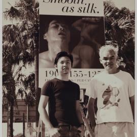 Designers with their Reinscribing Pleasure billboard, Taylor Square Darlinghurst, no date