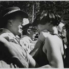 Police officer clasps protester around the throat, Sydney, 1991