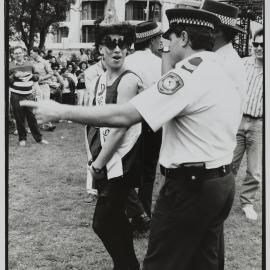 Police officer talks to protester, Kings Cross, 1990