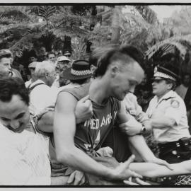 Police scuffle with protestors at Fred Nile 'Cleansing March', Fitzroy Gardens Elizabeth Bay, 1990
