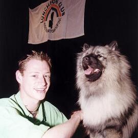 Luncheon Club member with mascot dog Cheon at a Luncheon Club event, 1999
