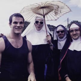 Ian Roberts with nuns at Mardi Gras Fair Day, Jubilee Park Glebe, 1995