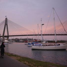 Couple walking along foreshore in Blackwattle Bay Park at dusk, Glebe, 2009