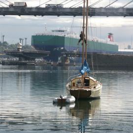 Man working up a yacht mast beside the Anzac Bridge, Blackwattle Bay, 2004