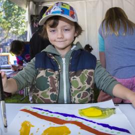 A child painting at the artwork tables, NAIDOC In The City, Hyde Park, 2014