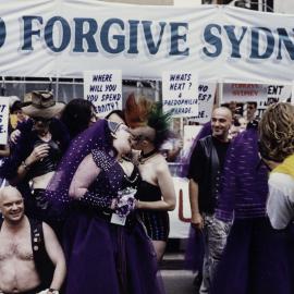 Lesbians kiss in front of Christian protest at Sydney Gay and Lesbian Mardi Gras Parade, Darlinghurst, 1999