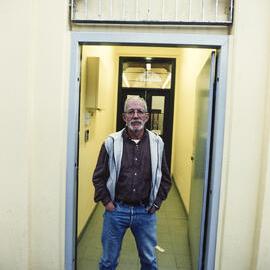 Mac McMahon at building entrance, 2000