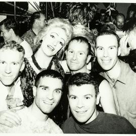 Drag queen Wander Aimlessly, Dominic O'Grady, and attendees of ACON Satanalia Christmas Party, 1999