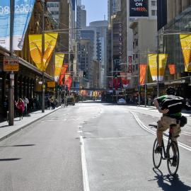 Person on bike, World Youth Day, George Street Sydney, 2008