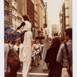 Performers on stilts, International Women's Day march, Sydney, 1988