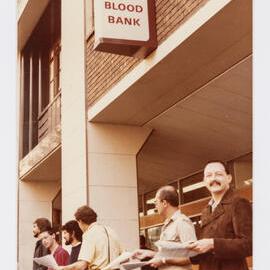 Handing out information, Red Cross Blood Bank, 1983