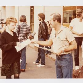 Handing out information, Red Cross Blood Bank, 1983