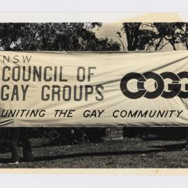 NSW Council of Gay Groups (COGG) against Gay Fed and 2nd Mardi Gras banner, 1981