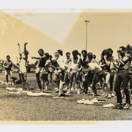 Leg race on unidentified sports field, circa 1979-1984