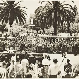 Streetscape with motorcade for royal visit of Queen Elizabeth II, Macquarie Street Sydney, 1954