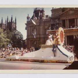 Float featuring sunflower in Waratah Festival Parade, circa 1965-1975