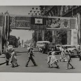 Wool industry arch decoration for royal visit of Queen Elizabeth II, Bridge Street Sydney, 1954