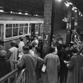 Site Fence Image - Boarding the tram, Wynyard underground station, 1958