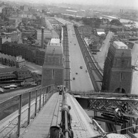 Site Fence Image - Atop Sydney Harbour Bridge, view south along the Bradfield Highway, 1936