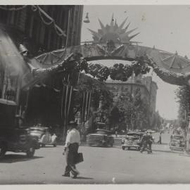Sun arch decorations for royal visit of Queen Elizabeth II, Bridge Street Sydney, 1954