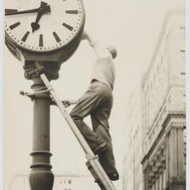 Servicing the Martin Place clock, circa 1960