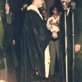 Lord Mayor Pat Hills and the torch for the 1956 Melbourne Olympic Games, Sydney Town Hall, 1956
