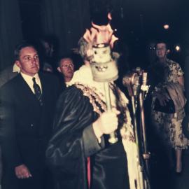 Lord Mayor Pat Hills holds the torch for the 1956 Melbourne Olympic Games, Sydney Town Hall, 1956