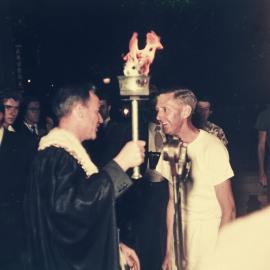 Lord Mayor Pat Hills with the torch for the 1956 Melbourne Olympic Games, Sydney Town Hall, 1956