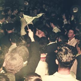 Crowd and the dummy torch for the 1956 Melbourne Olympic Games, Sydney Town Hall, 1956