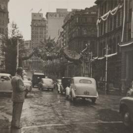 Sun arch decoration for royal visit of Queen Elizabeth II, Bridge Street Sydney, 1954