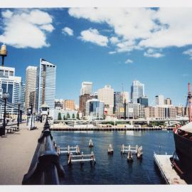 View across Cockle Bay towards Sydney city skyline from the Pyrmont Bridge Pyrmont, 1992