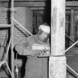 Operating an angle grinder, Paddington Town Hall, Oxford Street Paddington, circa 1976-1977