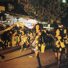 Monica Lewinskis dance along Oxford Street in the Mardi Gras Parade, 1999