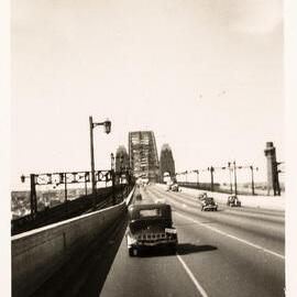 Cars driving over the Sydney Harbour Bridge, 1954