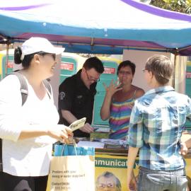Signing deaf language to consumer, Victoria Park, Mardi Gras Fair Day, 2012