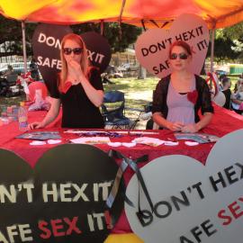 Two women at the Safe Sex stall, Victoria Park, Mardi Gras Fair Day, 2012