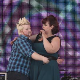 Drag King and girlfriend performing on main stage Drag, Victoria Park, Mardi Gras Fair Day, 2012