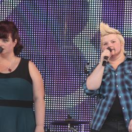 Drag King and girlfriend singing on stage, Victoria Park, Mardi Gras Fair Day, 2012