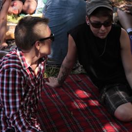 In deep conversation, Victoria Park, Mardi Gras Fair Day, 2012