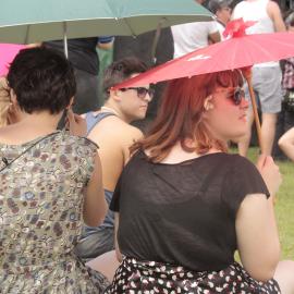 Under umbrellas, watching the stage, Victoria Park, Mardi Gras Fair Day, 2012