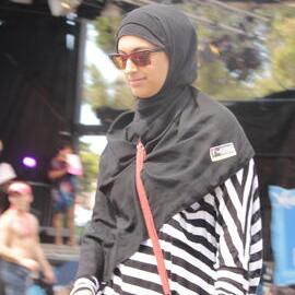 A Muslim woman in the crowd, Victoria Park, Mardi Gras Fair Day, 2012