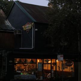 Lights come on in Tommy's Beer Café, Glebe Point Road, Glebe, 2021