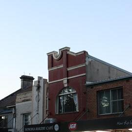 Lights coming on, shops at dusk, Glebe Point Road, Glebe, 2021