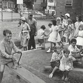 HM Queen Elizabeth II and the Duke of Edinburgh visit a children's playground