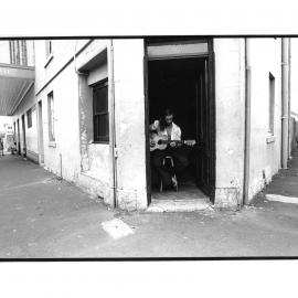 Guitarist in doorway